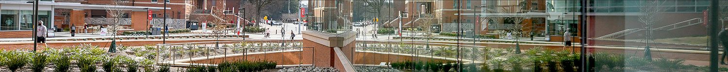 The Talley Student Center, reflected in the Wellness and Recreation Center on Cates Ave.